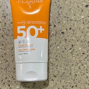 Clarins Sun Care Cream SPF 50+ in Orange and White